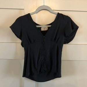 The Normal Brand button top